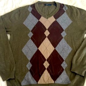 Olive green men’s sweater with plaid squares, brown, tan, and gray in the front